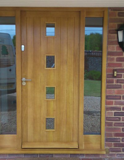 modern yellow timber front door with windows