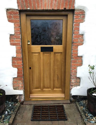 stained timber front door