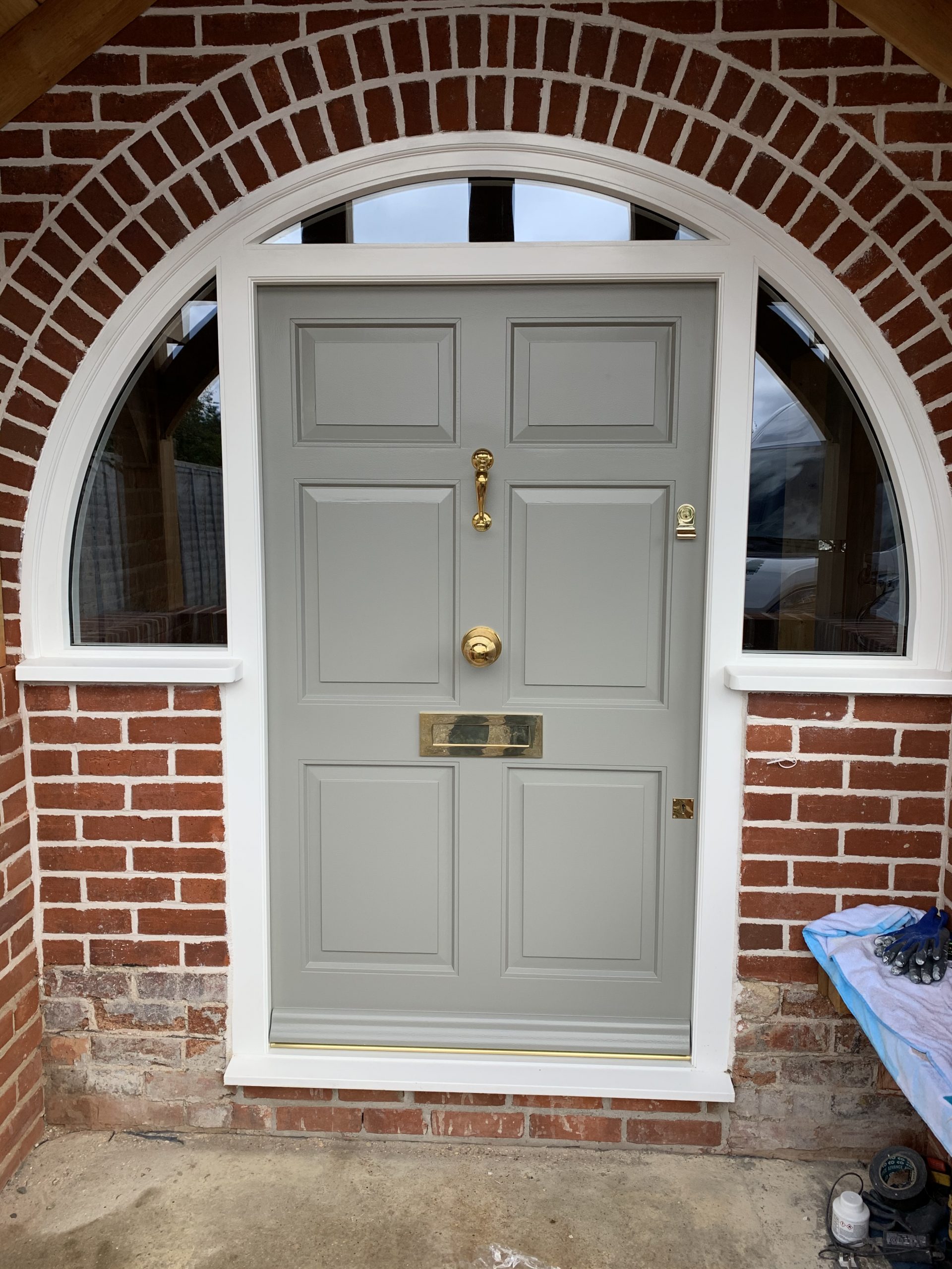 Front door with curved frame